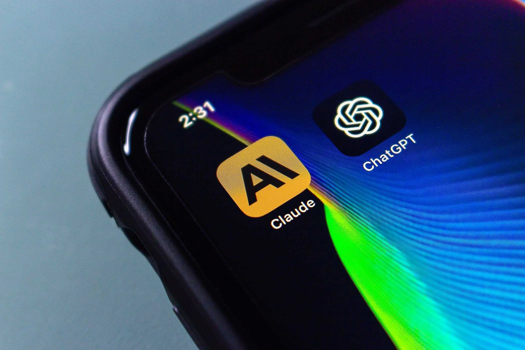 claude and chatgpt icons on smartphone screen.